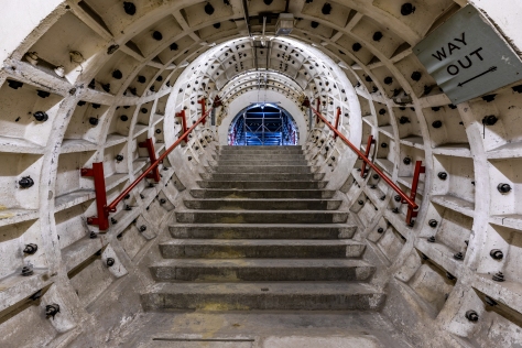 A concrete staircase leading on to a tunnel